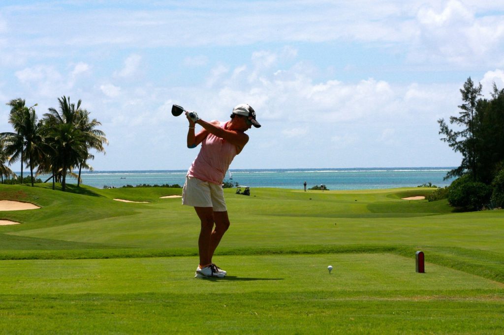 image: woman golfing 