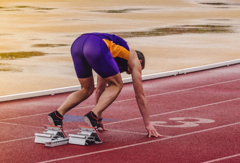 A track athlete was participating in a tournament. Photo by Serghei Trofimov from Unsplash