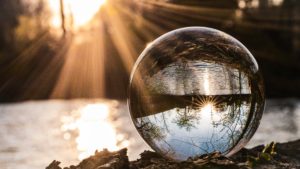 picture: sunset and landscape inverted through crystal ball. Not a great writing prompt on its own, since there's no 'why' or 'who', here!